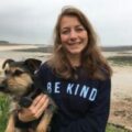 Picture of Dr. Joanna Woodnut and her dog at the beach