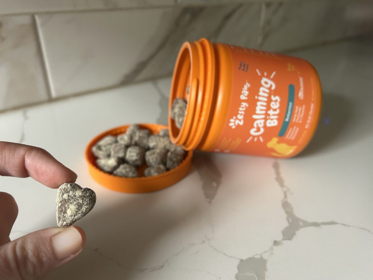 zesty paws calming bites chew with container tipped over in the background