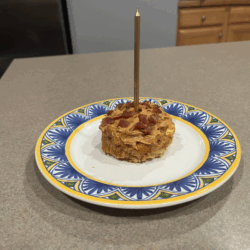 Homemade dog cake on a plate.