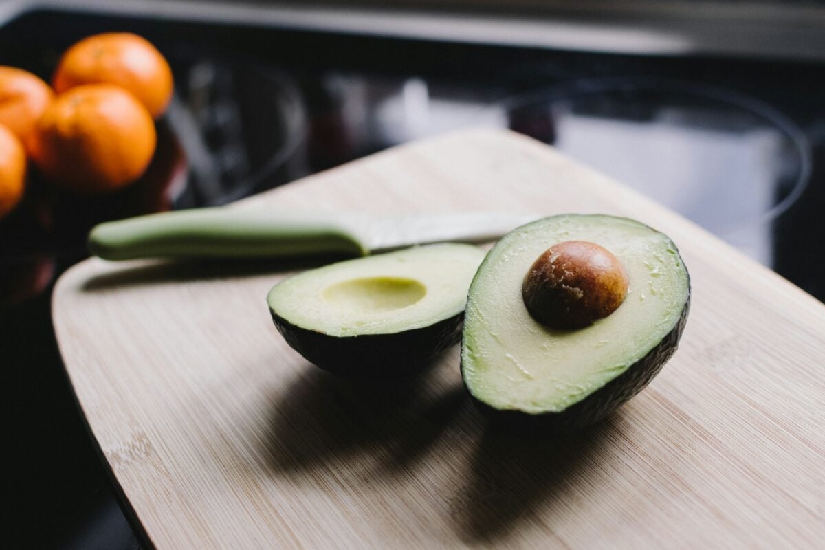 Perfectly ripe avocado cut in half.