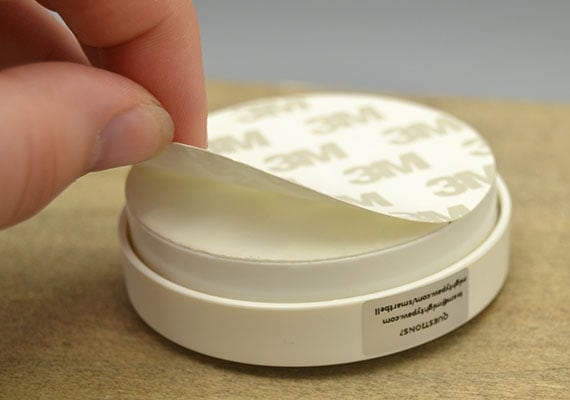 3M double sided tape being peeled of Mighty Paw Smart Bell dog doorbell