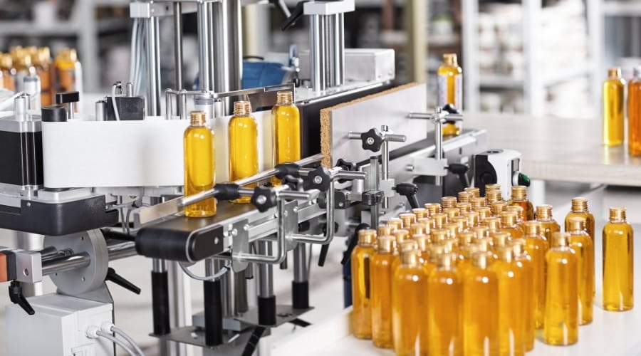Bottled chemicals for shampoo in a manufacturing facility.