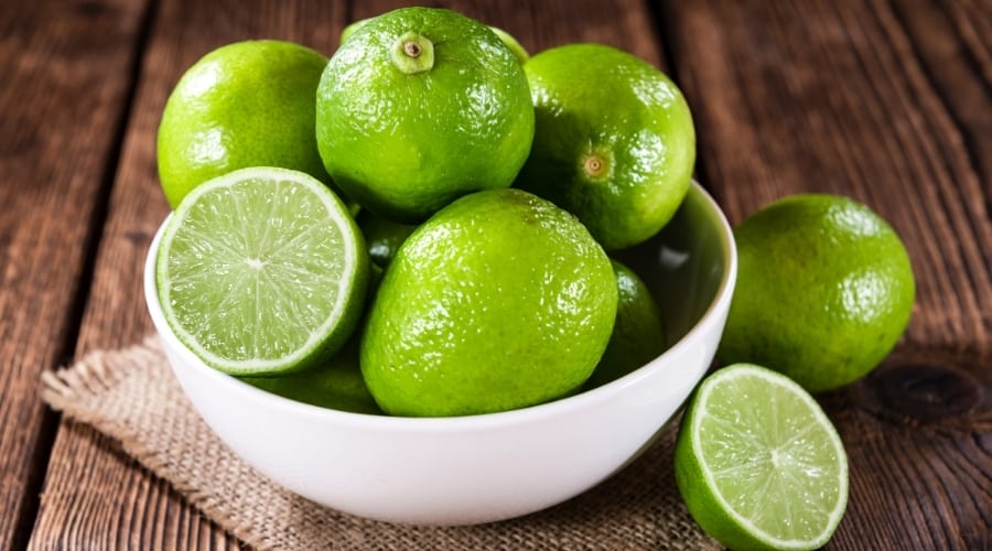 Bowl of Green Citrus Fruit