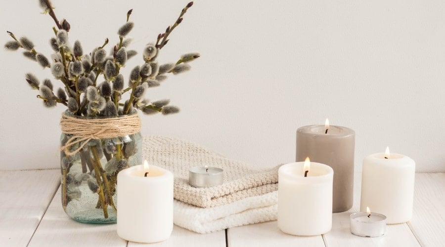 Candles and Towels on a Table Surface