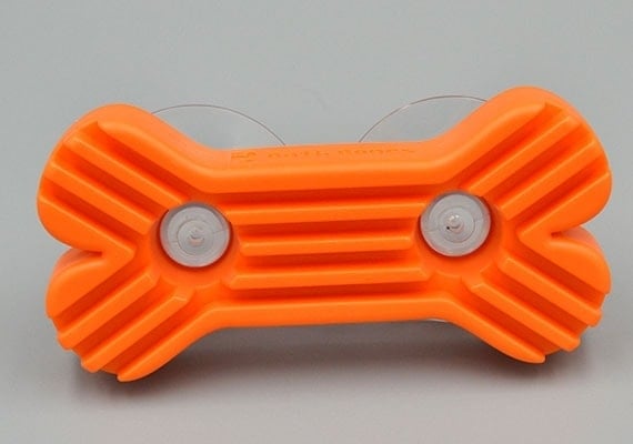 Close up on bath bones orange lick mat with suction cups