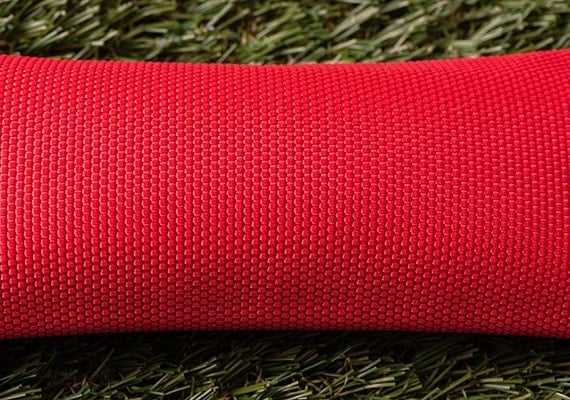 Close up on surface of red fire hose dog toy