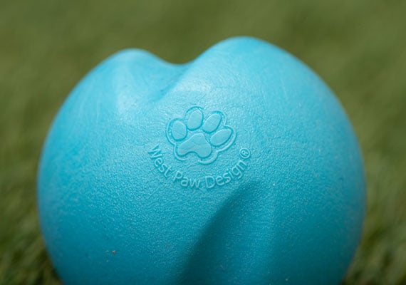 Close up on the surface of blue West Paw Jive dog tennis ball