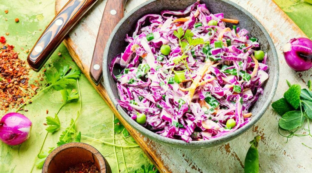 Cole slaw overhead on a table with ingredients.