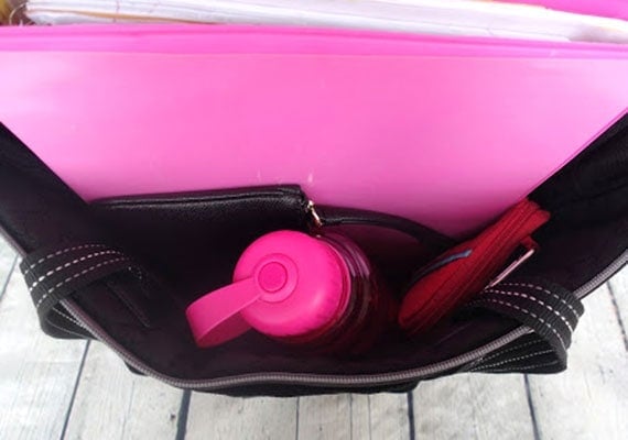 Collapsible dog bowl folded neatly inside handbag