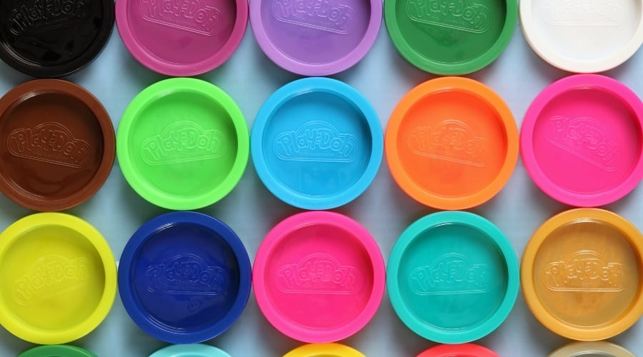 Colorful lids of play-doh containers.