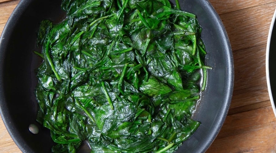 Cooked kale in pan