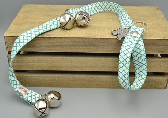 Hanging dog doorbell with strap that loops over door knob