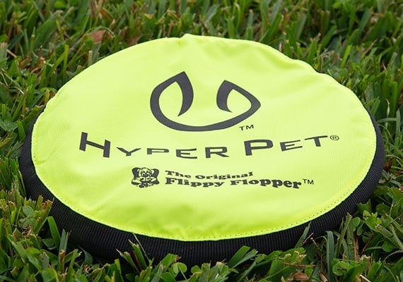 Hyper Pet Flippy Flopper Dog Frisbee on grass in park