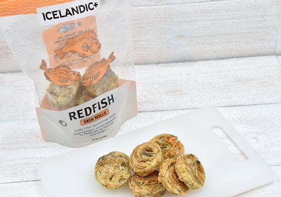 Icelandic Plus Redfish Skin Rolls treats for dogs open bag next to individual treats