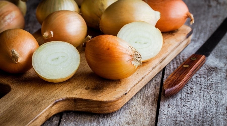 Onions on a cutting board.