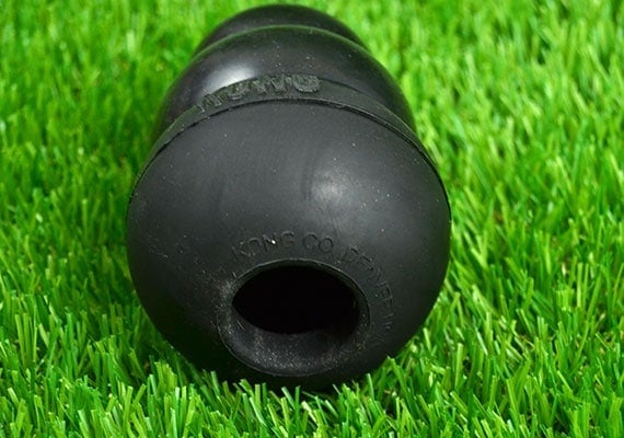 Opening on the bottom of the Kong Extreme Black Rubber Chew Toy