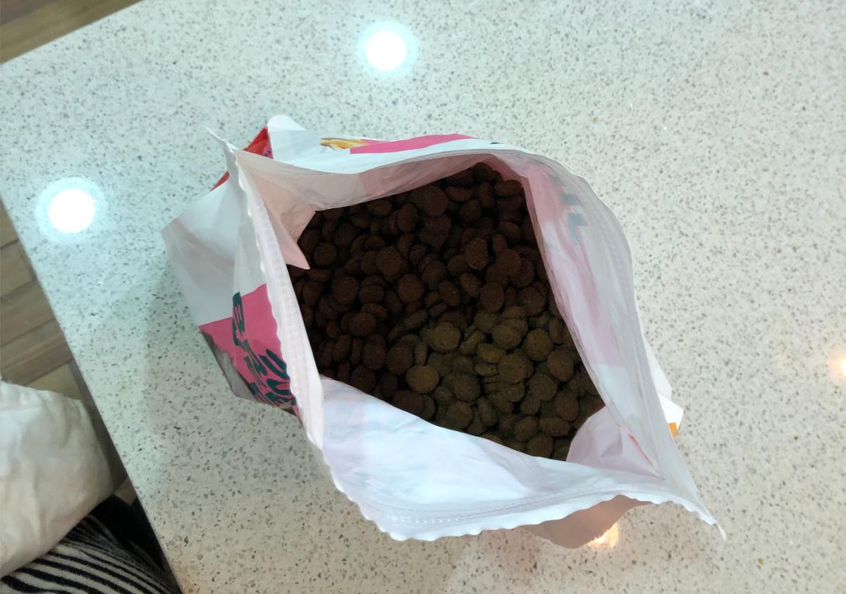 Overhead of Jinx dog food bag on a counter.