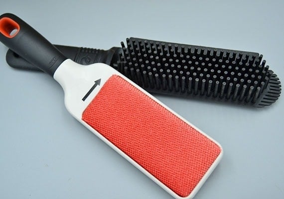 Rubber bristled pet hair remover compared to traditional lint brush fur remover