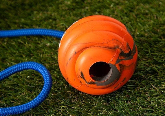 Underside of Nero Ball UItra orange Rubber Ball Reward Toy