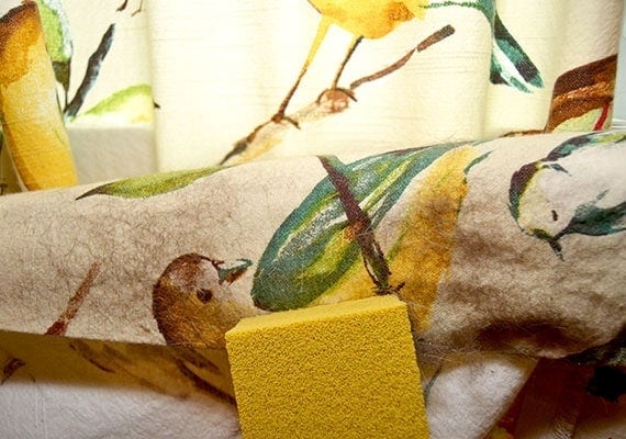 Using the gonzo per hair lifter to remove dog hair from curtains