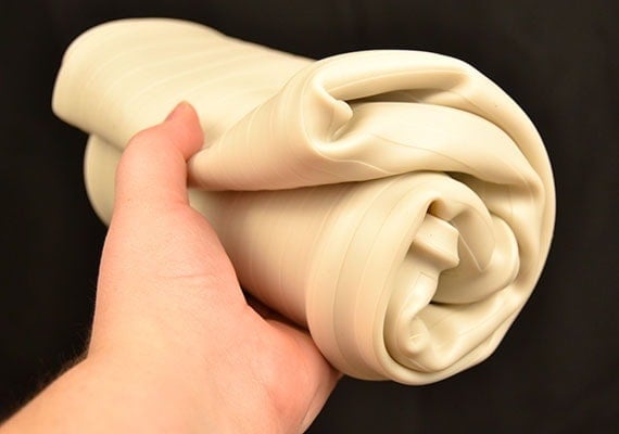 Wee Wee Silicone Pad holder rolled up in hand
