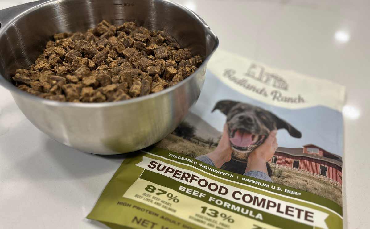 bowl of Badlands Ranch kibble with empty bag on counter