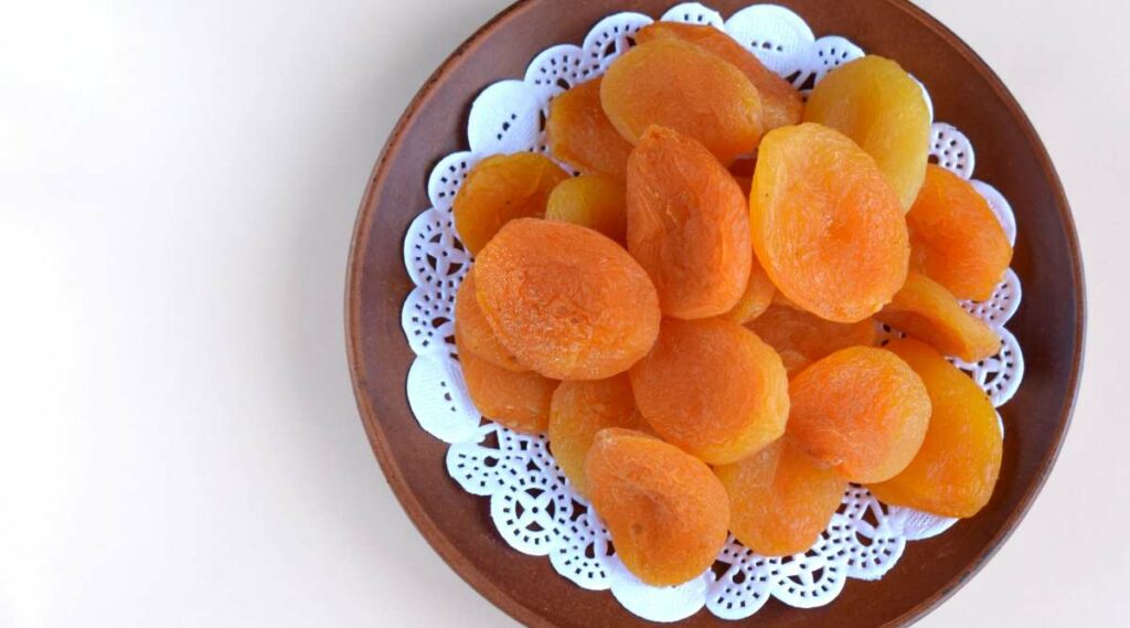 A bowl of dried apricots.
