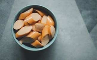 Bowl of sliced hot dogs