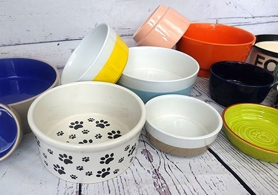 Ceramic dog bowls in a pile ready to be tested and reviewed