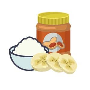 Jar of Peanut Butter with sliced bananas and bowl of yogurt