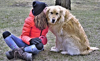 Girl kissing dog