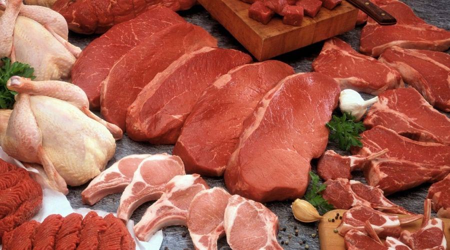 Raw meats on a table.