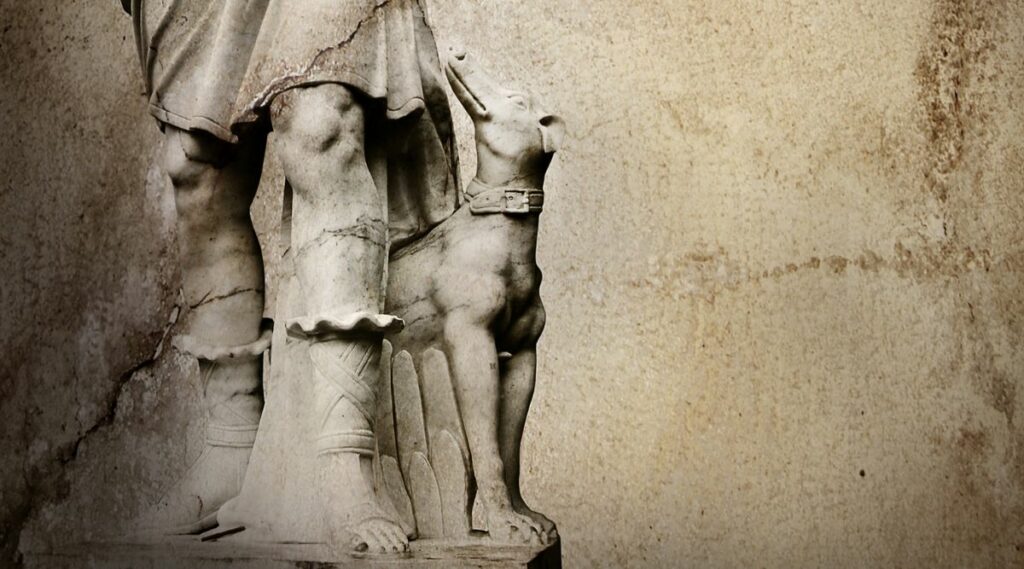 old green statue with dog next to Grecian