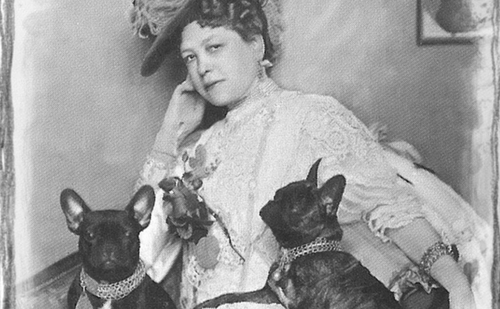 Old photo of woman with dogs.