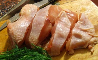 Raw chicken breast in slices