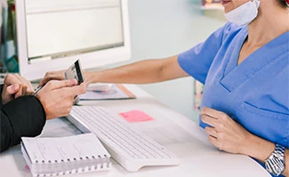 Girl paying vet bill