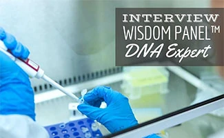 Scientist in lab with test (Caption: Interview Wisdom Panel DNA Expert)