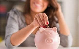 Woman Saving Money in piggy bank